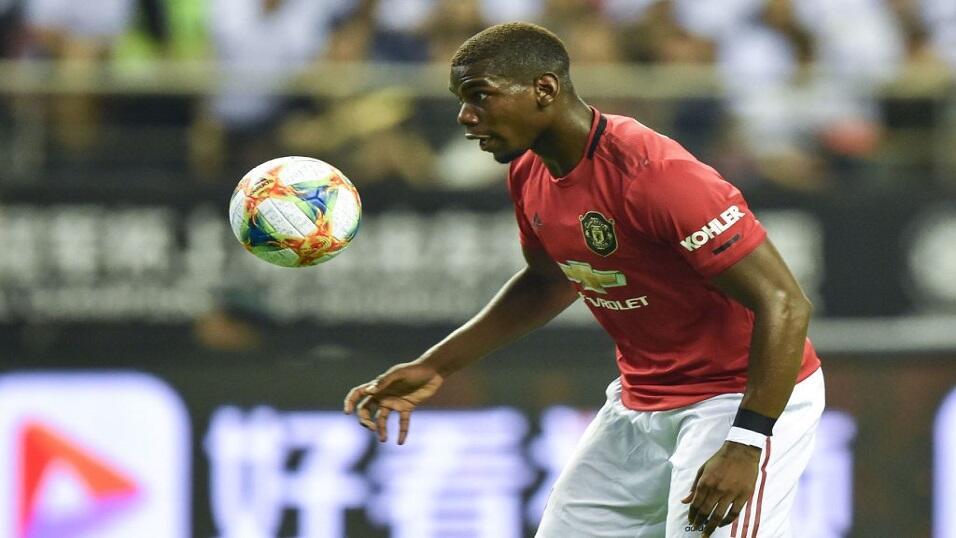 Paul Pogba playing for Manchester United